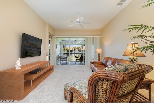 living room featuring carpet and ceiling fan