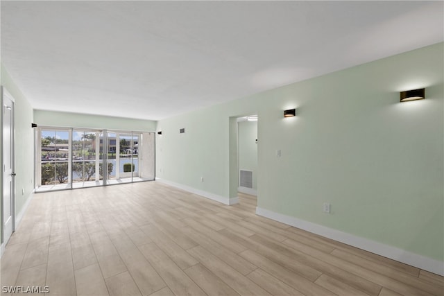 unfurnished room featuring light wood-type flooring