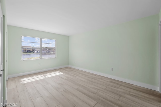 unfurnished room featuring light hardwood / wood-style floors