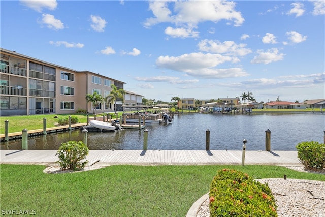 dock area featuring a yard and a water view