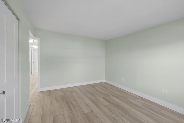 unfurnished room with light wood-type flooring