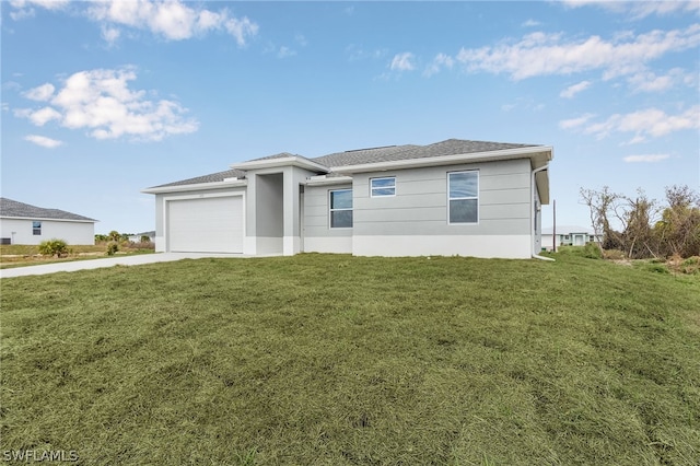 view of front facade featuring a garage and a front lawn