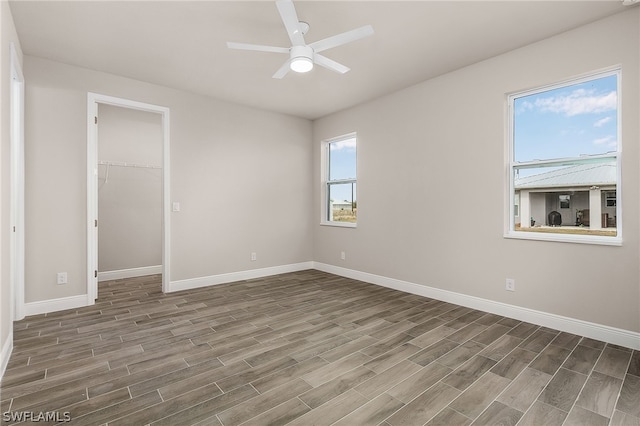 empty room featuring hardwood / wood-style flooring and ceiling fan