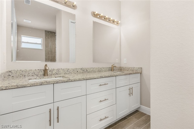 bathroom featuring double sink vanity