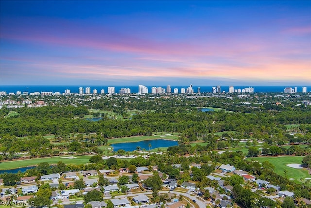 aerial view at dusk with a water view