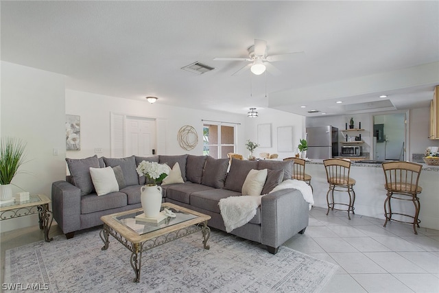 living room with ceiling fan and light tile floors