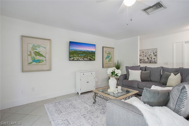 living room with ceiling fan and light tile floors