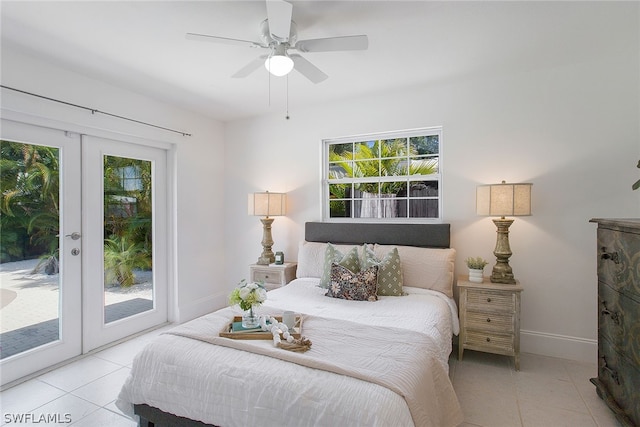 tiled bedroom featuring multiple windows, ceiling fan, french doors, and access to outside