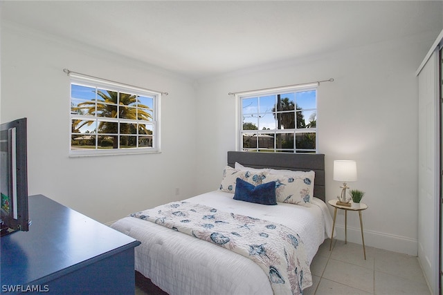 tiled bedroom with crown molding