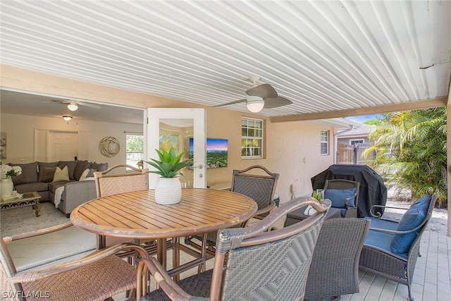 dining room with ceiling fan and french doors