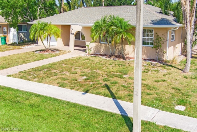 view of front of home with a front lawn