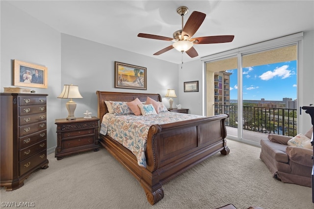 bedroom featuring ceiling fan, floor to ceiling windows, light carpet, and access to outside