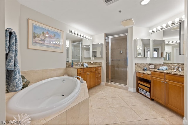 bathroom featuring vanity, plus walk in shower, and tile patterned flooring