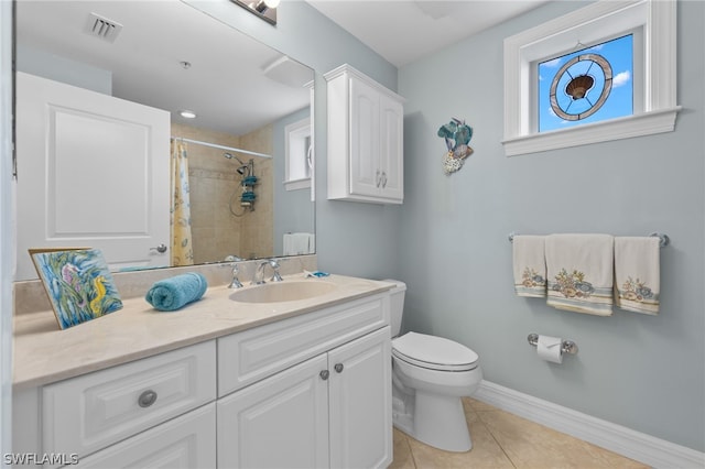 bathroom with tile patterned flooring, vanity, a shower with curtain, and toilet