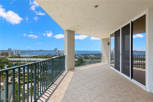 balcony featuring a water view