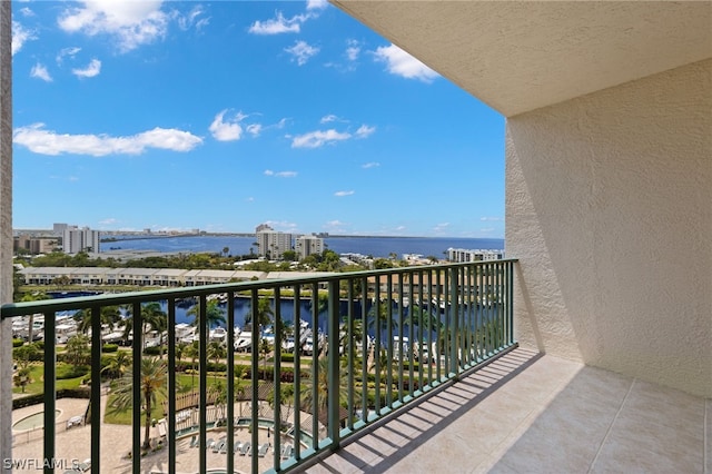 balcony featuring a water view