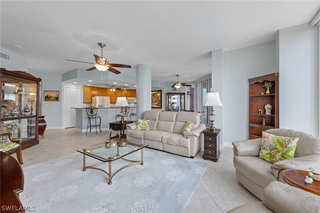 living room featuring light tile patterned floors and ceiling fan