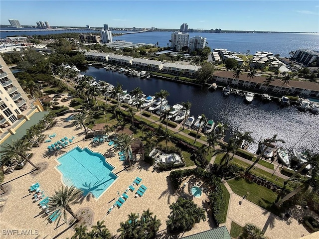 birds eye view of property with a water view