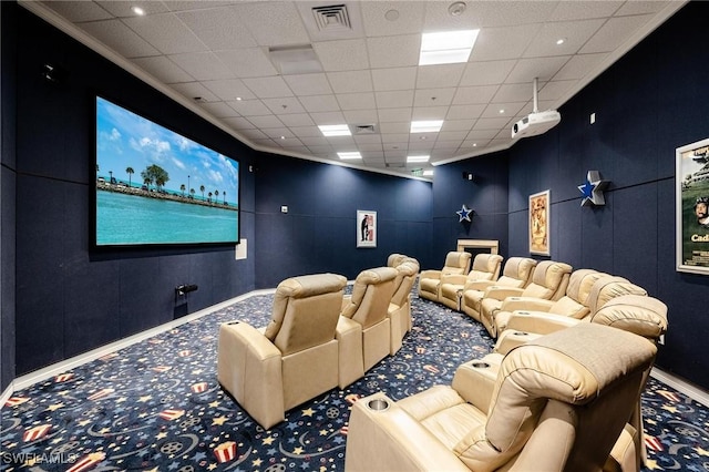 home theater room featuring a drop ceiling and carpet floors