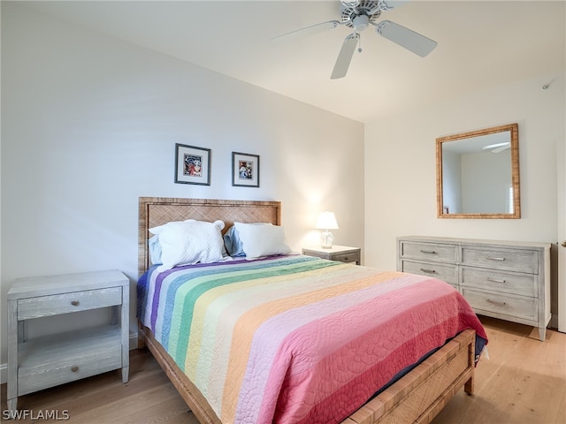 bedroom with light hardwood / wood-style flooring and ceiling fan