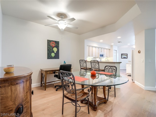 dining room featuring ceiling fan and light hardwood / wood-style floors