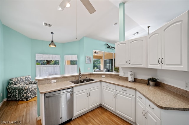 kitchen featuring white cabinetry, pendant lighting, sink, and stainless steel dishwasher