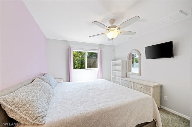 carpeted bedroom featuring multiple windows and ceiling fan