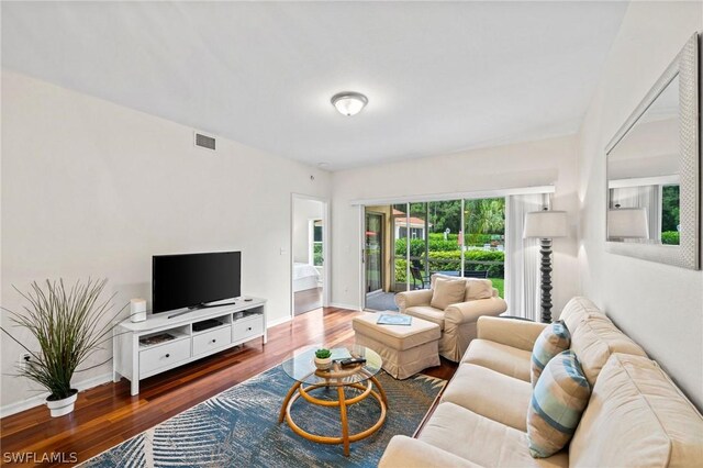 living room with dark wood-type flooring