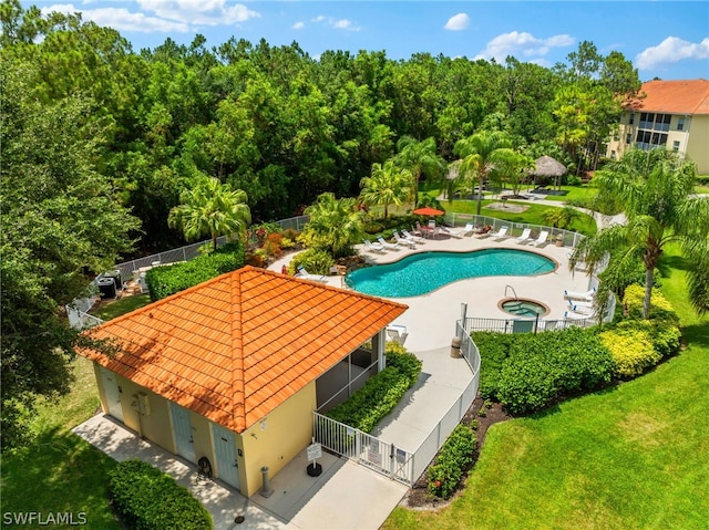 view of swimming pool with a lawn and a patio area