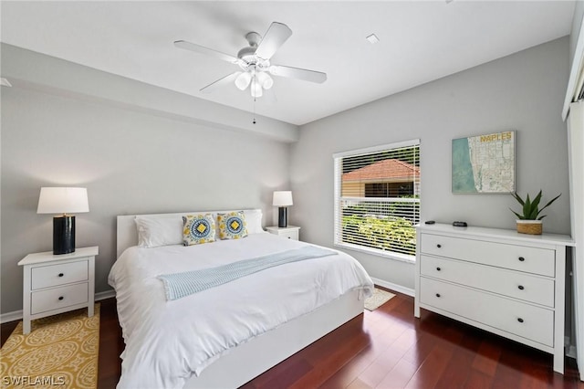 bedroom featuring ceiling fan and dark hardwood / wood-style flooring