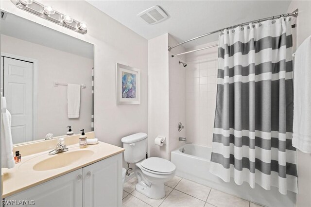 full bathroom featuring tile flooring, shower / tub combo with curtain, toilet, and vanity