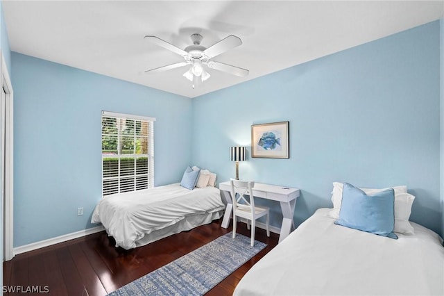 bedroom featuring dark wood-type flooring and ceiling fan