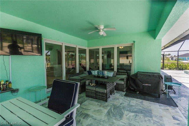 view of patio with ceiling fan, glass enclosure, outdoor lounge area, and area for grilling