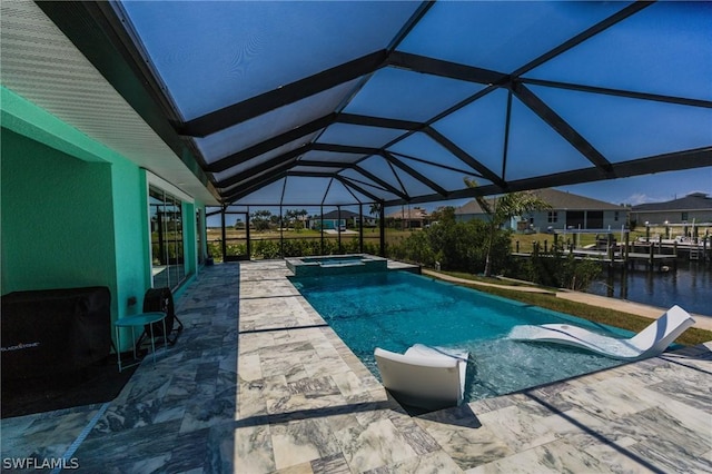 view of swimming pool featuring glass enclosure, an in ground hot tub, a water view, and a patio