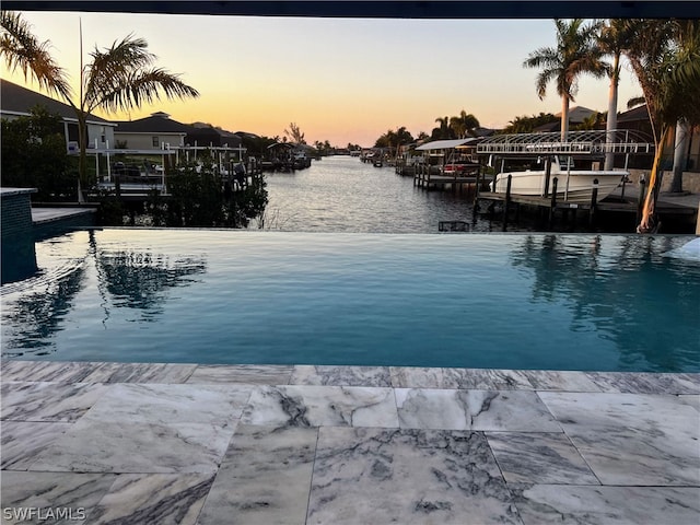 exterior space with a dock and a water view