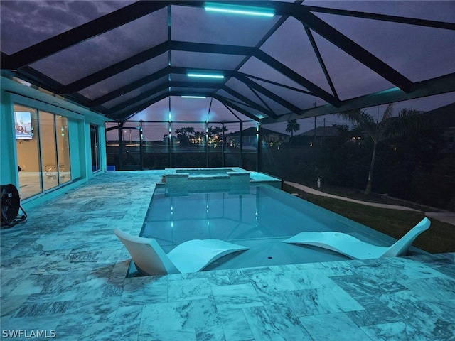 view of pool featuring an in ground hot tub and a lanai