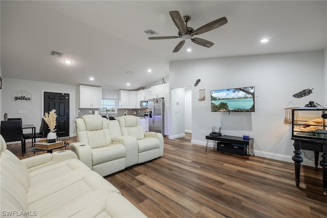 living room featuring ceiling fan, lofted ceiling, and dark hardwood / wood-style flooring