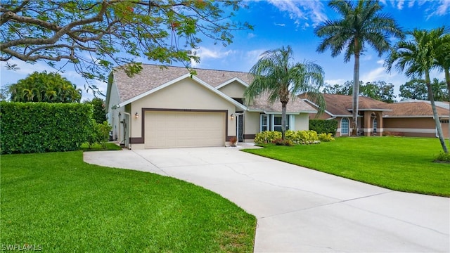 ranch-style home with a garage and a front lawn