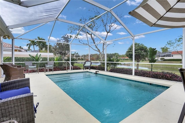 view of pool with a water view, a patio, and a lanai