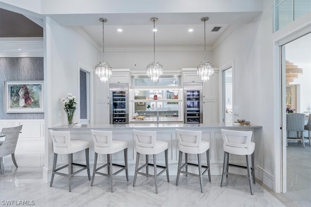 kitchen with a kitchen breakfast bar, pendant lighting, and light tile floors