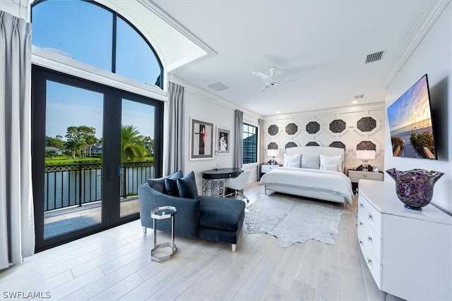 bedroom with light hardwood / wood-style floors, access to exterior, ceiling fan, ornamental molding, and french doors