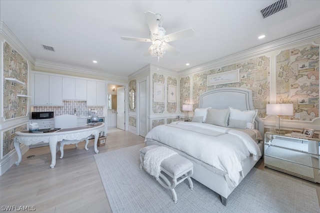 bedroom featuring ceiling fan, light hardwood / wood-style floors, and crown molding