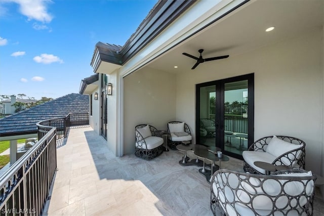 exterior space featuring ceiling fan and a balcony