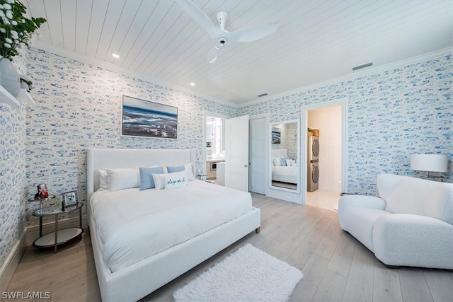 bedroom featuring crown molding, light wood-type flooring, connected bathroom, wood ceiling, and ceiling fan