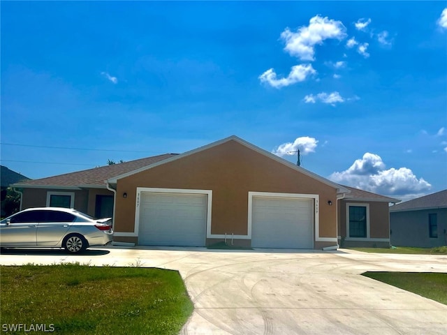 single story home with a garage