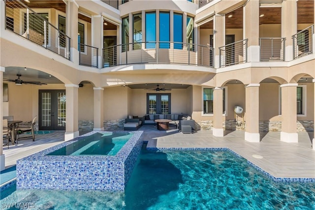 exterior space with outdoor lounge area, a patio area, french doors, and a balcony