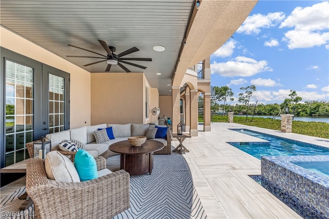 view of patio with an outdoor living space and ceiling fan