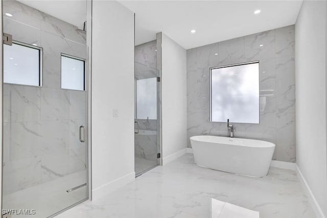 bathroom with shower with separate bathtub