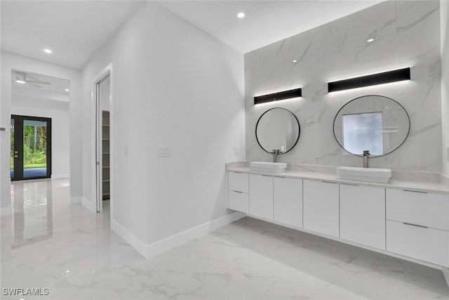 bathroom with ceiling fan and vanity