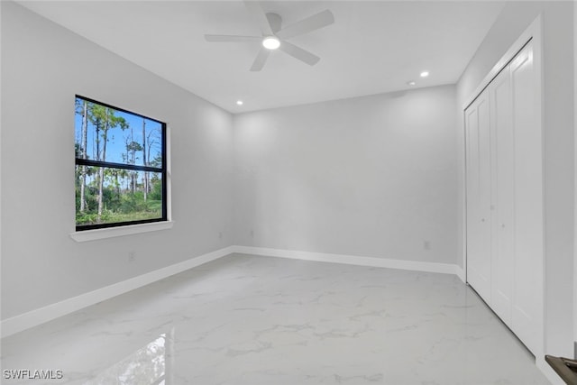 169 18th Ave NW, Naples, FL 34120 - empty room with marble finish floor, baseboards, ceiling fan, and recessed lighting